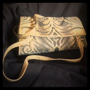 Sharif handbag rich reptile filigree design.
